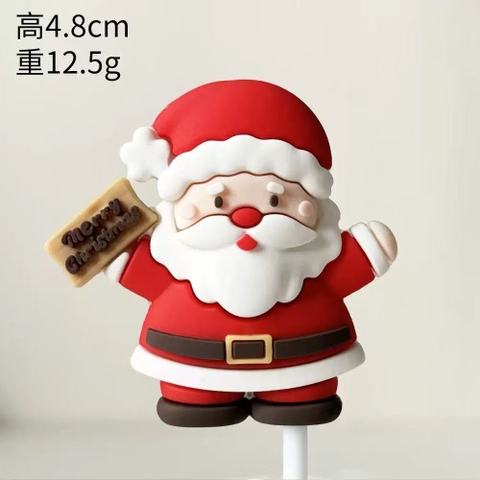 Tượng nhựa dẻo (loại dày)-ông già noel cầm bảng chữ Xmas màu nâu.