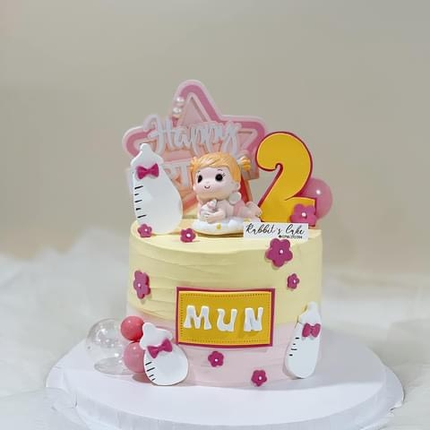 Tượng em bé nằm ôm bình sữa -BÉ GÁI (sứ).