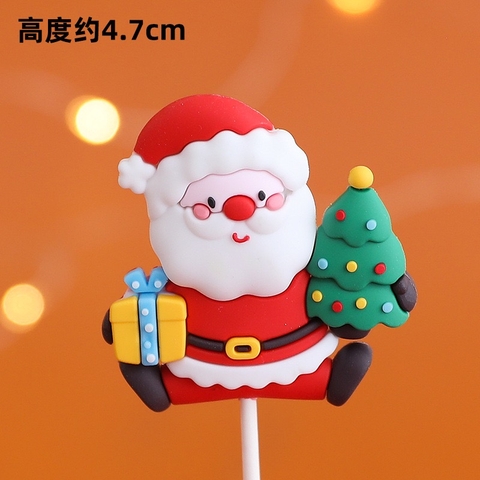 Tượng nhựa dẻo loại dày-ông già noel ôm quà và cây thông.