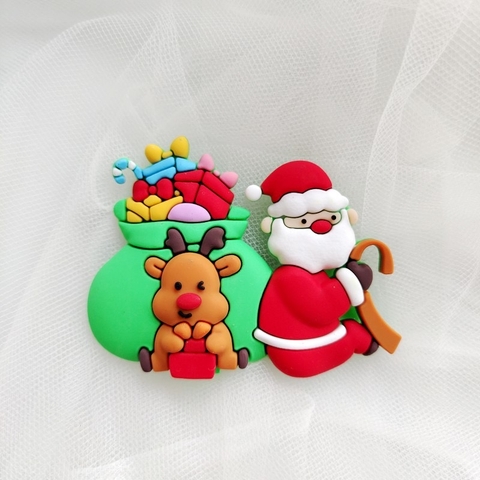 Tượng nhựa dẻo-Ông già noel cõng túi quà xanh có tuần lộc.
