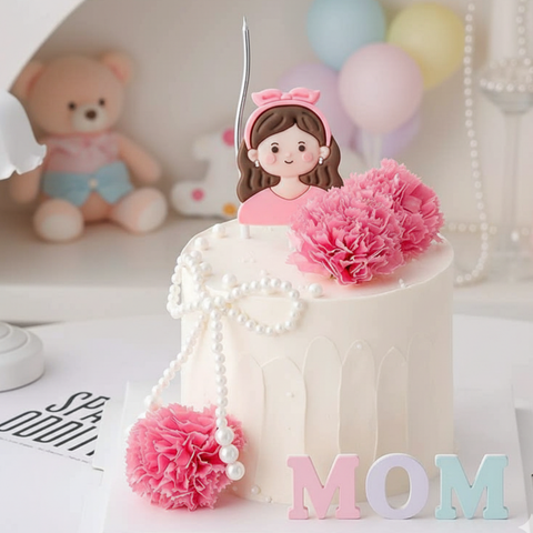 Tượng nhựa dẻo - Mẹ áo hồng, tóc cài nơ hồng.