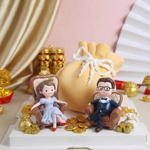 Tượng quý bà giày đỏ váy xanh ngồi ghế (nhựa).