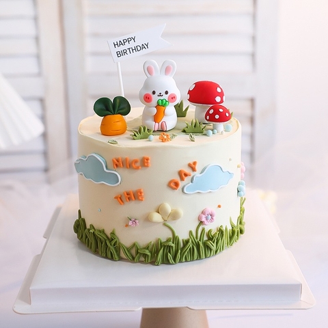 Tượng thỏ nhựa silicon cầm carrot (con).