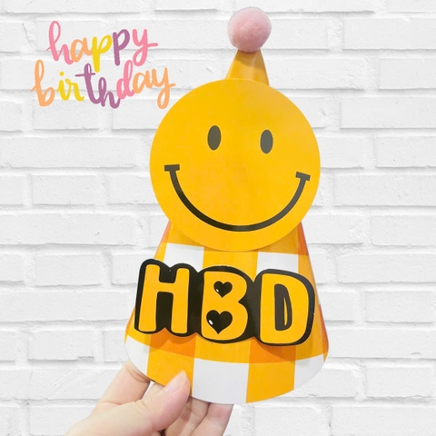 Set 10 mũ 3D cán bóng giấy đẹp kt dk 13cmx cao 20cm - nền caro vàng gắn mặt cười.m13