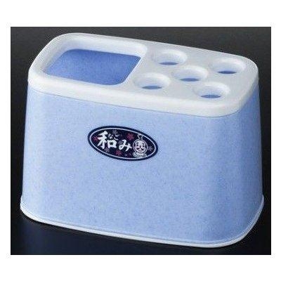 Giá cắm bàn trải kem đánh răng màu xanh