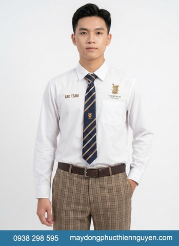 Đồng phục học sinh trường Sedbergh Vietnam - BCIS, áo sơ mi trắng kết hợp với cà vạt xanh đậm phối với sọc vàng đồng, logo trường được thêu sắc nét