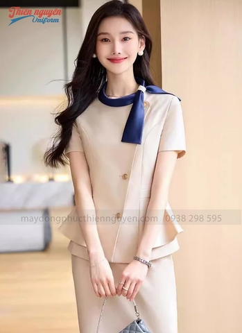 Mẫu đồng phục nhân viên lễ tân spa cổ nơ màu be