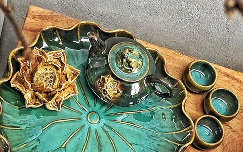 Bộ ấm chén vuốt tay hỏa biến NT