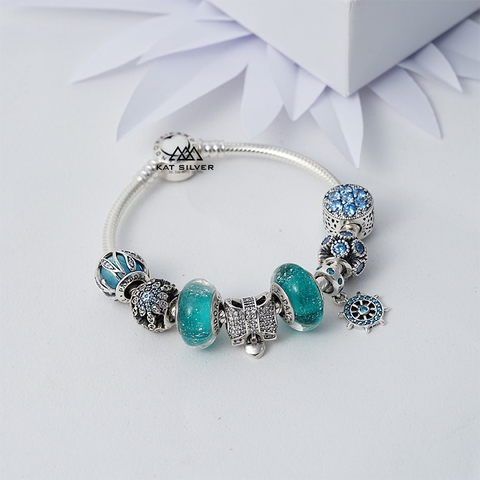 VÒNG CHARM NƠ TRẮNG ĐÁ XANH DISNEY