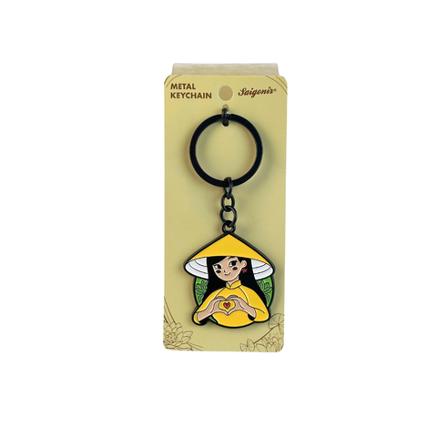 Moc khoa kim loai hinh Co gai Ao dai Vang tha tim (Hand Heart)