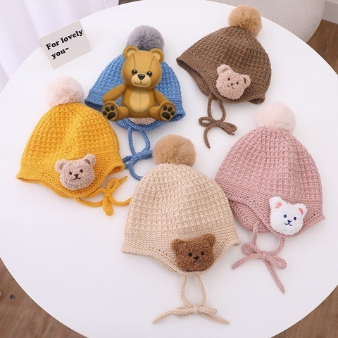 Mũ len quả bông đính gấu