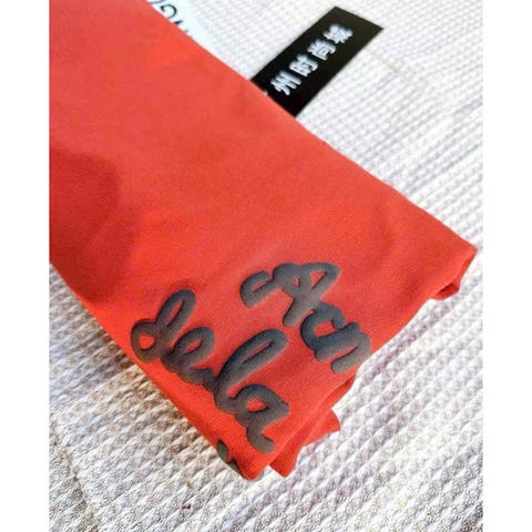 A211-Áo thun suông màu cam in chữ