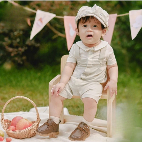Bộ liền cộc màu ghi phối trắng đính nơ Nous
