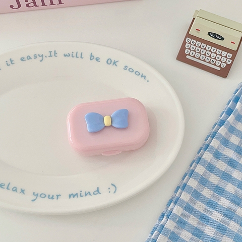 Khay gương gắn nơ kèm dụng cụ đeo