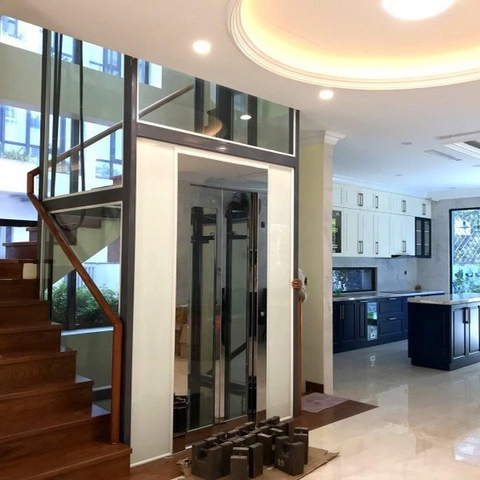 Tháng máy khung kính