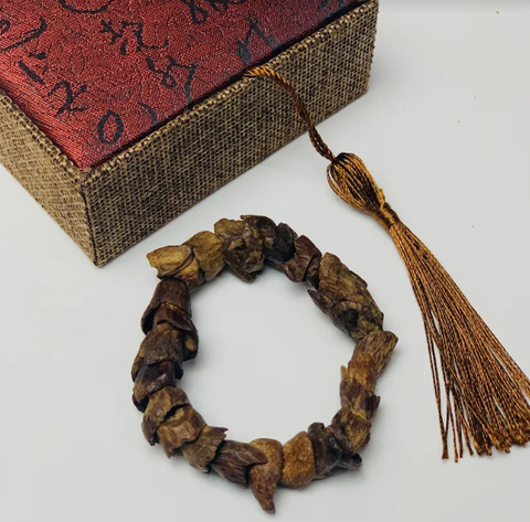 Vòng Trầm Mắt tử chìm - Lào