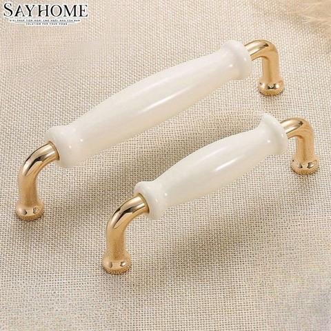 Tay nắm tủ hiện đại màu vàng gold mặt sứ trắng SH5537