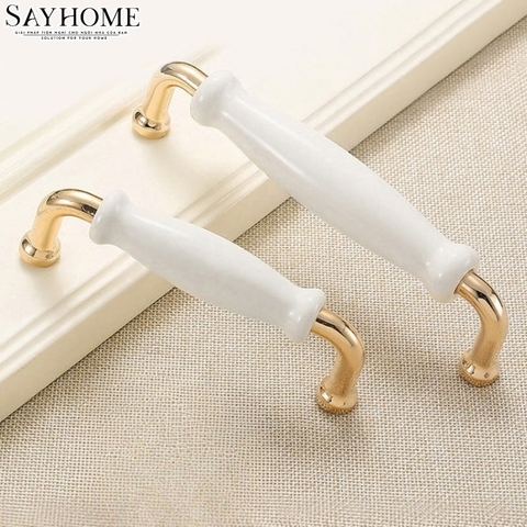 Tay nắm tủ hiện đại màu vàng gold mặt sứ trắng SH5537