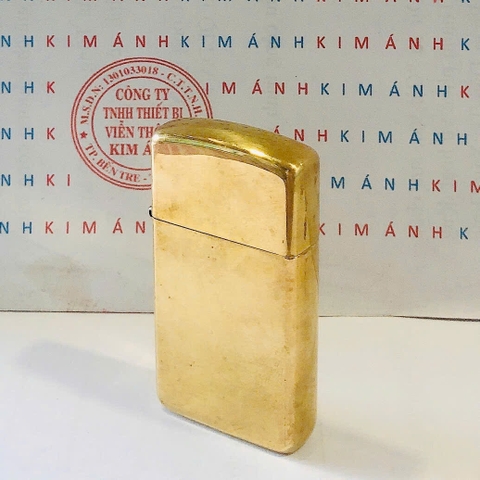 Bật lửa Zippo Slim Mỹ Brass trơn sản xuất 2006, hàng chính hãng có giấy nhập khẩu gửi kèm theo đơn hàng