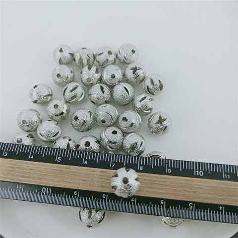 gói2- 5-10 charm rỗng khắc hoa văn bằng đồng size 10mm
