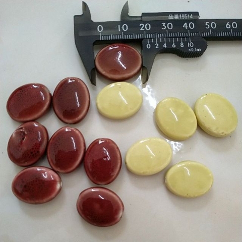 2viên gốm sứ oval dẹp 16x22mn