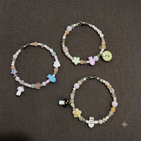 Vòng cứng mix hạt charm