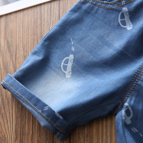 Quần short jean bé trai in hình ô tô lưng chun dây rút