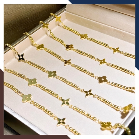 Lắc chân bi vàng 10k phối hoa 4 cánh đẹp cho nữ mã TL150