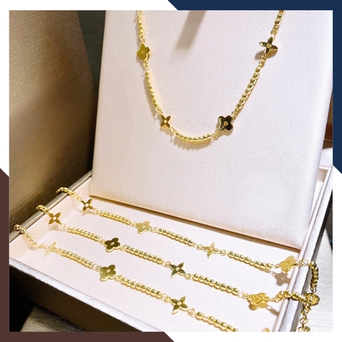 Lắc tay bi vàng tây 10k mix charm hoa 4 cánh cho nữ đẹp mã TL107