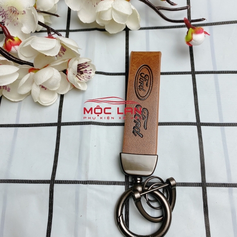 Móc khoá dây da T2 dài chất liệu da bò dập chìm logo