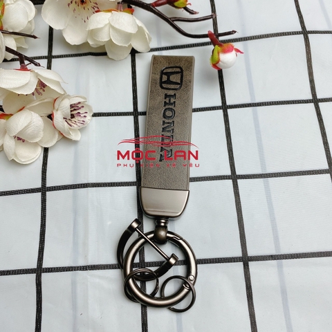 Móc khoá dây da T2 dài chất liệu da bò dập chìm logo