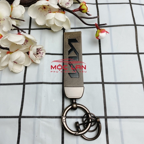Móc khoá dây da T2 dài chất liệu da bò dập chìm logo
