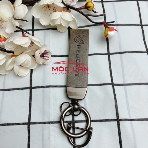 Móc khoá dây da T2 dài chất liệu da bò dập chìm logo