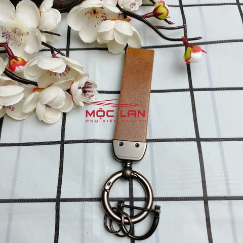 Móc khoá dây da T2 dài chất liệu da bò dập chìm logo