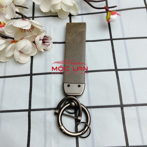 Móc khoá dây da T2 dài chất liệu da bò dập chìm logo