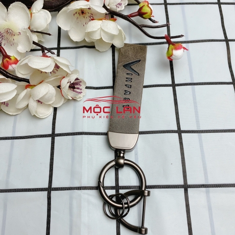 Móc khoá dây da T2 dài chất liệu da bò dập chìm logo