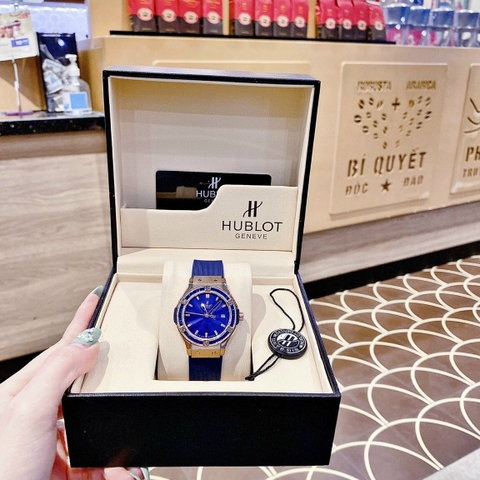 Hublot Geneve |Nữ Giới |Rose Gold |Đính Đá |Dây Silicone Xanh |Máy Pin (Máy Quartz) |Size 34mm