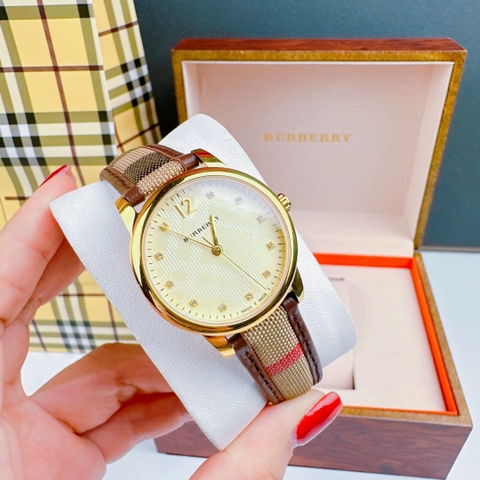 Burberry The Classic |Nữ Giới |Mặt Vàng |Dây Vải Bọc Da Nâu |Máy Pin (Quartz) |Size 32mm
