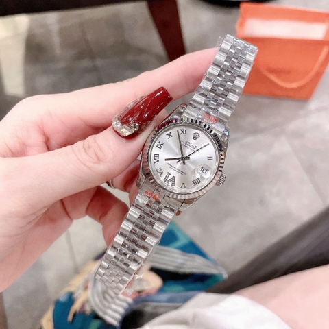 Rolex Mặt Số La Mã |Nữ Giới |Trắng |Niềng Khía |Dây Kim Loại Silver |Máy Pin (Máy Quartz) |Size 31mm