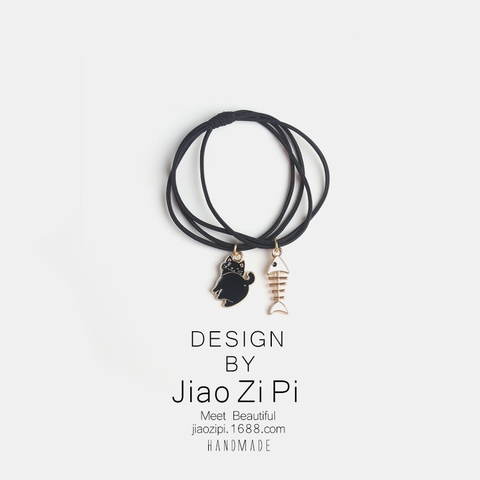 Dây buộc tóc cao su đen hình mèo và xương cá