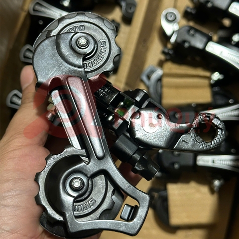 CÙI ĐỀ 7S SHIMANO TY21B MÀU ĐEN TOURNEY BẮT ỐC