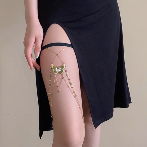 Butterfly necklace worn on thigh