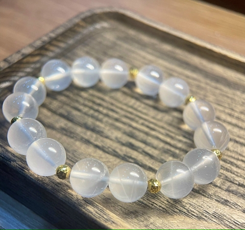 Vòng tay thạch anh trắng mix bi vàng 10k