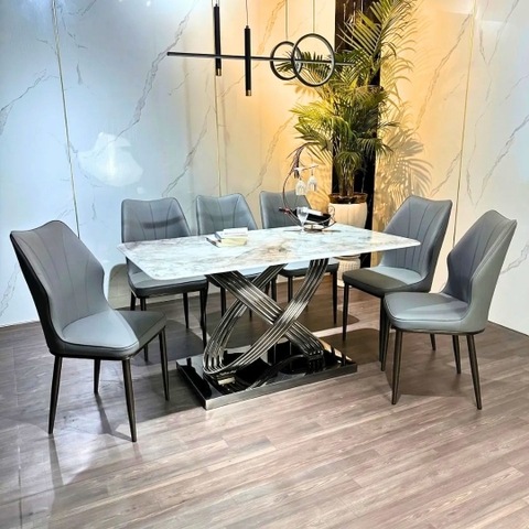 Bàn ăn Valentina mặt đá thạch anh vi tinh thể xuyên sáng với chân inox nghệ thuật. 
