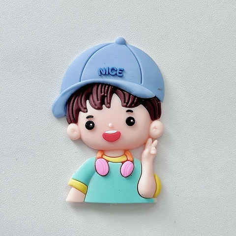 Trang trí silicon cậu bé đeo tai nghe đội mũ xanh