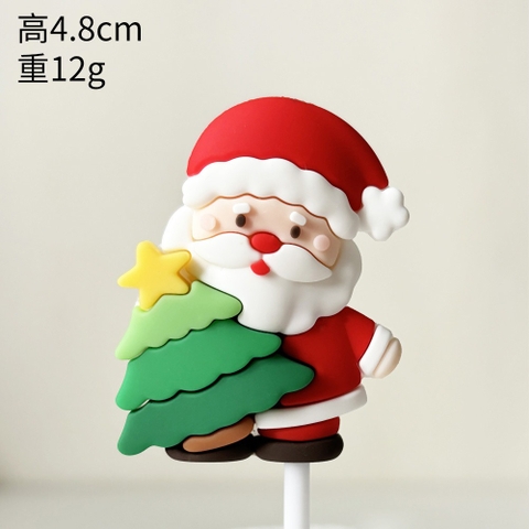 Trang trí slc GS ông già Noel cầm cây thông xanh 2024