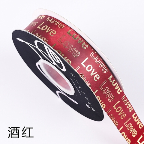 Rb love chữ nhũ vàng màu đỏ đô khổ 2,5cm*29m
