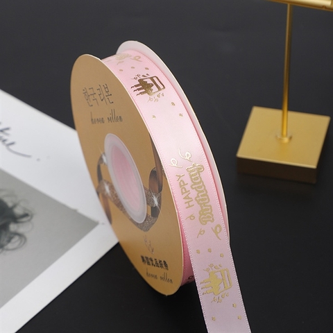 RB HPBD chữ nhũ VÀNG nền HỒNG 2.5cm*50m