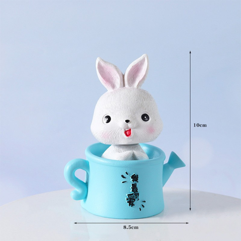 Đồ chơi Thỏ sứ ngồi bình tưới màu XANH