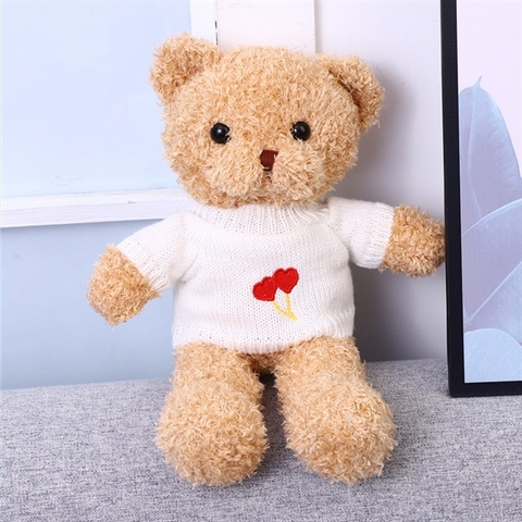 Gấu bông VÀNG áo trắng trái tim 30*22cm